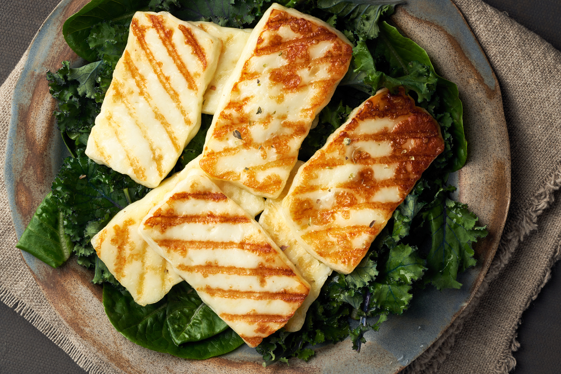 Cyprus fried halloumi cheese with healthy green salad. Lchf,